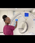 Radiographer Annie Murambiwa with a new CT scanner at Wirral Diagnostics Centre
